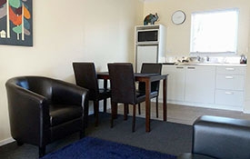 fully-equipped kitchen of 1-bedroom apartment